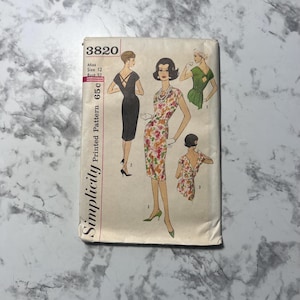 May include: Simplicity Printed Pattern 3820 for Misses Size 12, Bust 32. The pattern includes three dress designs: a black dress with a keyhole back, a floral print dress with a scoop neck, and a green dress with a scoop neck and a keyhole back.