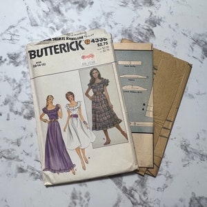 May include: A vintage sewing pattern for a dress with a ruffled neckline and a plaid skirt. The pattern is from Butterick and is size 12-14-16. The pattern is for a dress with a ruffled neckline and a plaid skirt. The pattern is from Butterick and is size 12-14-16.