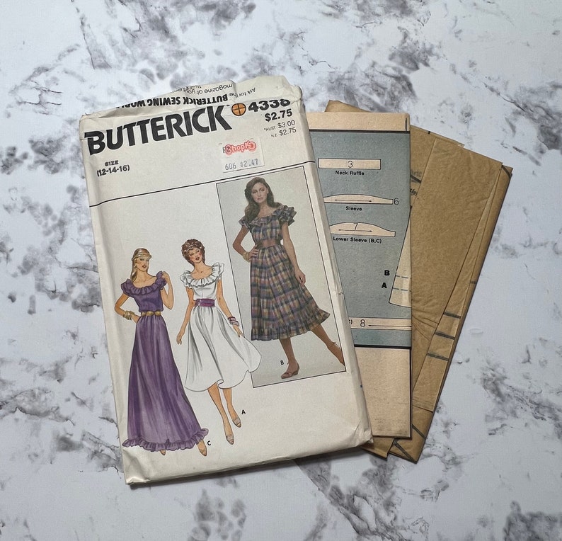 May include: A vintage sewing pattern for a dress with a ruffled neckline and a plaid skirt. The pattern is from Butterick and is size 12-14-16. The pattern is for a dress with a ruffled neckline and a plaid skirt. The pattern is from Butterick and is size 12-14-16.