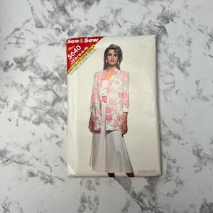 May include: A vintage sewing pattern for a blazer and skirt. The pattern is for sizes 12-14-16 and is available in large sizes. The pattern is from See & Sew and has the number 5640 on it.