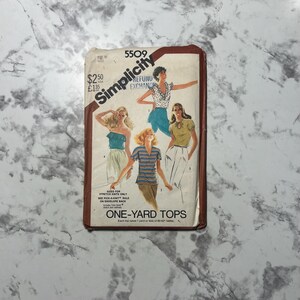 May include: Vintage Simplicity sewing pattern 5509 for one-yard tops. The pattern envelope features illustrations of women wearing various top styles. The text includes "Sized for Stretch Knits Only" and "One-Yard Tops."
