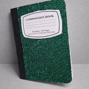 May include: A green glitter composition book with a black spine. The cover features a white label with the words "COMPOSITION BOOK" and details: 60 sheets, 120 pages, and dimensions of 4.5 in x 3.25 in.