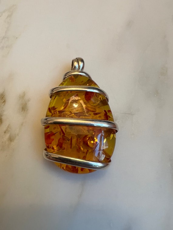 Sterling wrapped natural amber pendant