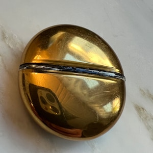 Vintage Mary Dunhill gold tone perfume flask. 2” around.