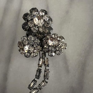 Antique Austrian rhinestone flowers spray brooch. 3.5” long X 1.5” wide. Good condition.