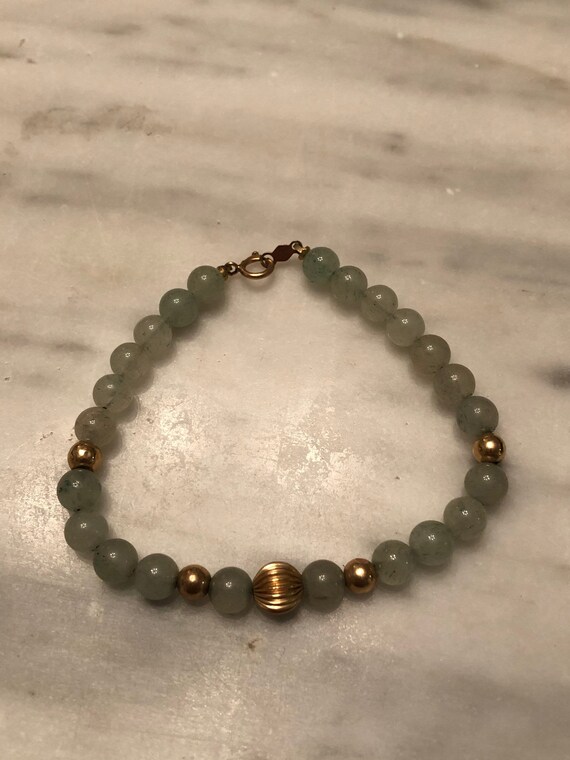 Genuine jade bead and 14k gold bead and clasp brac