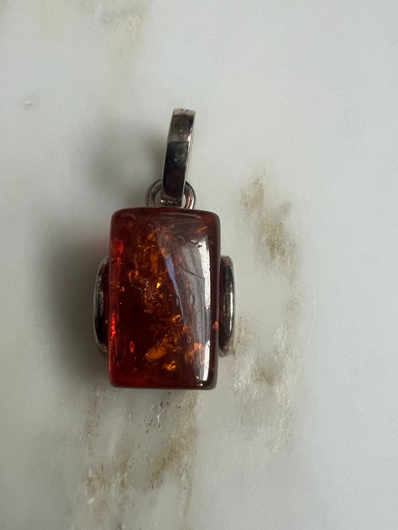 Sterling silver and genuine amber pendant