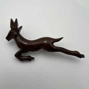 Vintage carved good leaping gazelle brooch