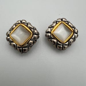 Vintage Premier Designs gold and silver tone clip earrings with pearlescent center