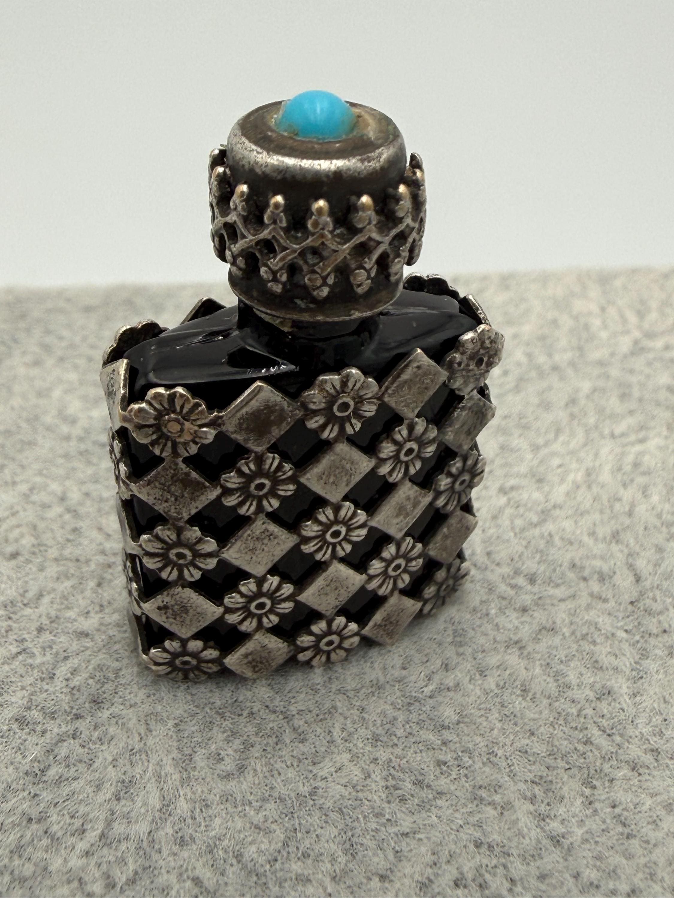 A Vintage French Miniature Perfume Bottle With a Sterling Silver