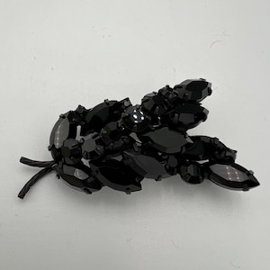 Vintage Japanned black rhinestone leaf brooch