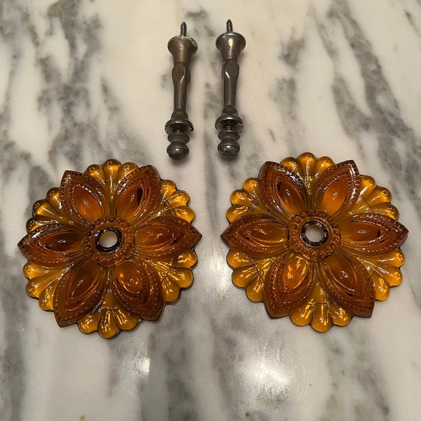 Pair of antique amber glass curtain tiebacks with hardware