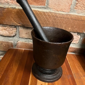 Antique heavy cast iron footed mortar and pestle