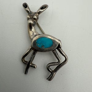 vintage southwest sterling silver deer brooch with turquoise