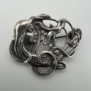 Vintage sterling silver art nouveau style figural brooch pendant of a woman with flowing hair