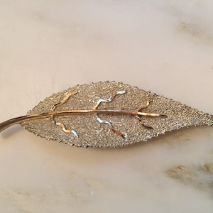 Vintage gold tone bsk leaf brooch