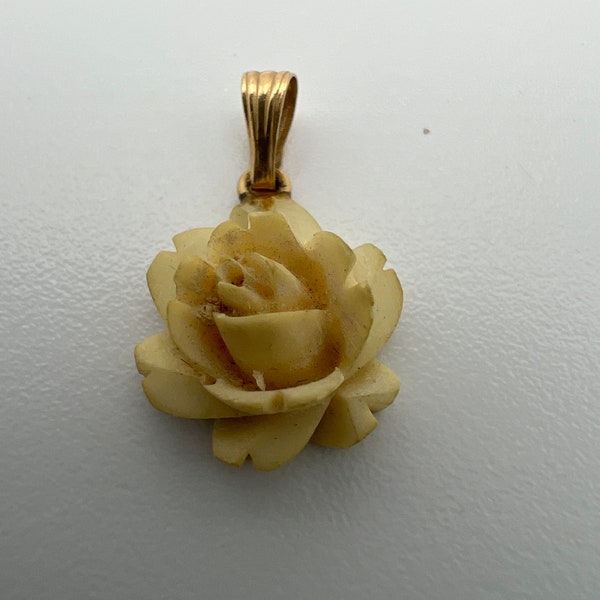 Vintage small carved flower pendant with 14k gold bale