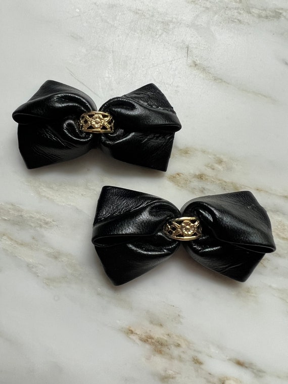Vintage black leather and gold accent shoe clips
