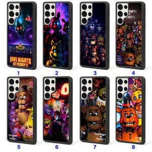 May include: A collection of eight black phone cases featuring colorful illustrations of characters from the video game "Five Nights at Freddy's." Each case displays a different design, showcasing various characters and scenes.
