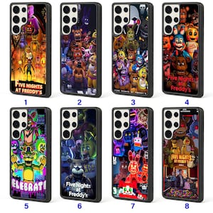 May include: A collection of black phone cases featuring colorful graphics from the video game "Five Nights at Freddy's." Each case displays different characters and scenes, with text including the game's title and other phrases.