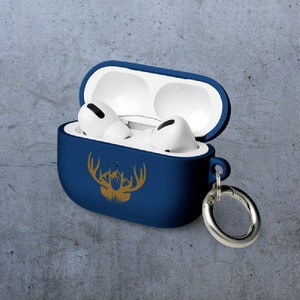 May include: A blue silicone case for wireless earbuds with a gold deer silhouette design and a silver metal carabiner.