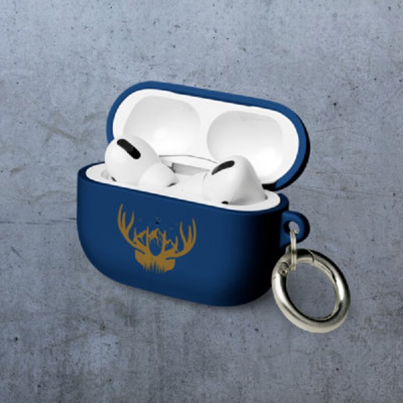 May include: A blue silicone case for wireless earbuds with a gold deer silhouette design and a silver metal carabiner.