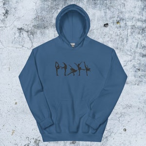 May include: A dark blue hooded sweatshirt with a graphic of five figure skaters in silhouette on the front.