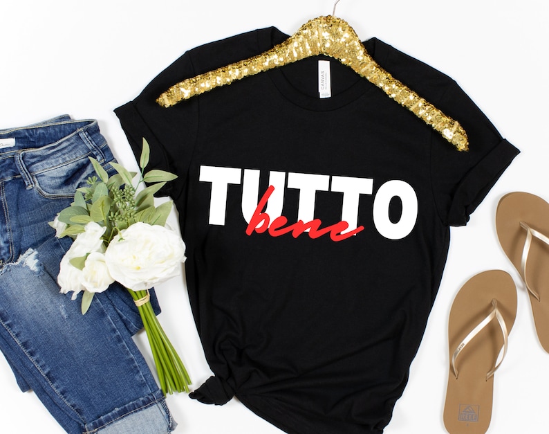 May include: Black t-shirt with white text that says "TUTTO bene" in red.