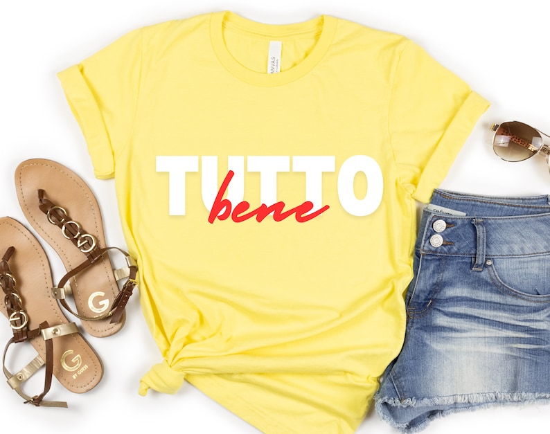 May include: Yellow t-shirt with the text "TUTTO bene" in white and red lettering.