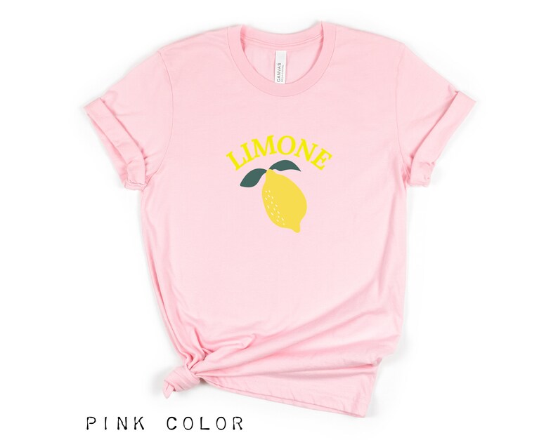 May include: Pink t-shirt with a yellow lemon graphic and the word "LIMONE" in yellow letters.