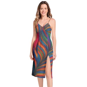 May include: A colorful, knee-length dress with a vibrant, abstract pattern of swirling lines in shades of red, orange, yellow, green, blue, and purple. The dress features a V-neckline, spaghetti straps, and a thigh-high slit on the left side.