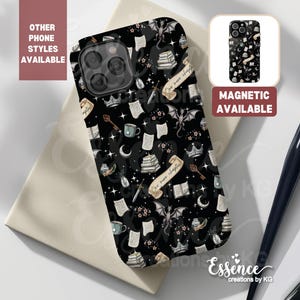 May include: Black phone case with a whimsical design featuring books, a dragon, and a quill pen. The text "One more chapter" is visible on the case.  The case is magnetic.