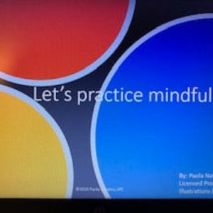 May include: A presentation slide with the text "Let's practice mindfulness" in white text on a black background. The background also features three overlapping circles in red, yellow, and blue.
