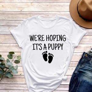 Hoping it's 2025 a puppy shirt