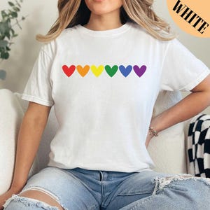 a poster with different colors and sizes of shirts
