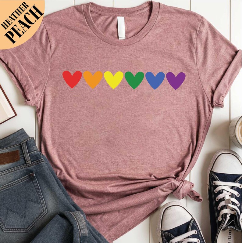 a women's t - shirt with hearts drawn on it
