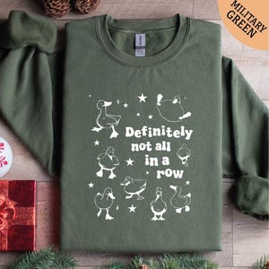 a green t - shirt that says definitely not all in a row