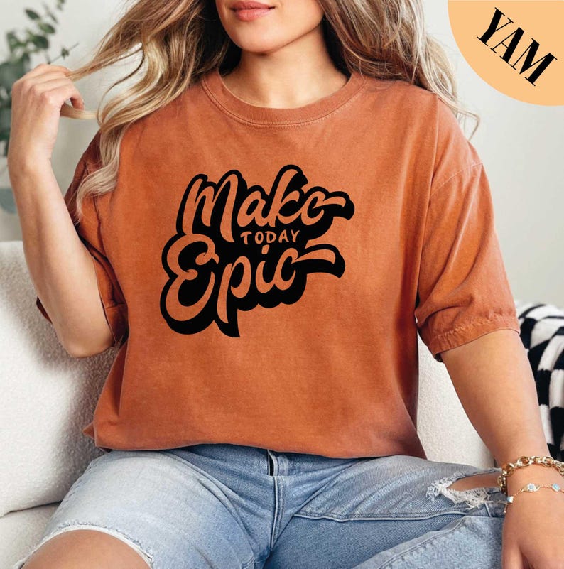 a woman sitting on a couch wearing a brown shirt