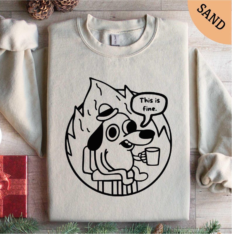 a white sweatshirt with a cartoon dog on it