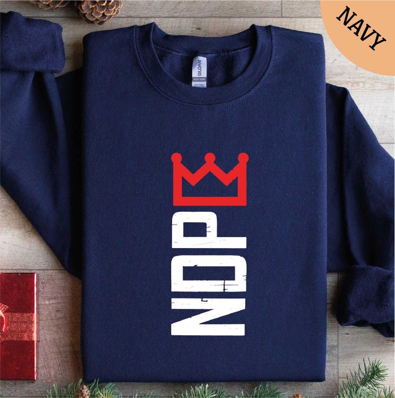 a navy sweatshirt with a crown on it