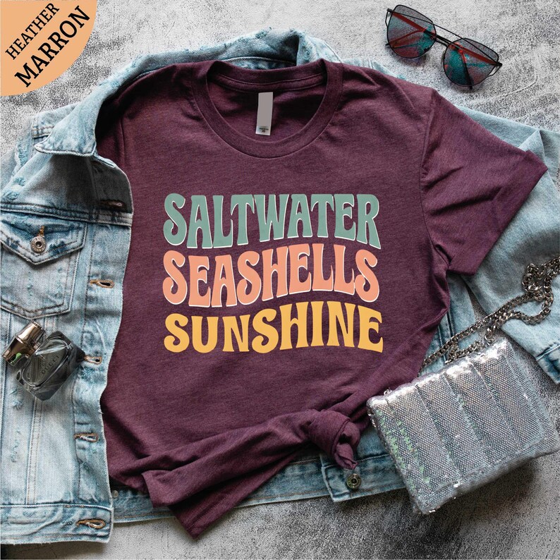 a t - shirt that says saltwater seashells sunshine on it