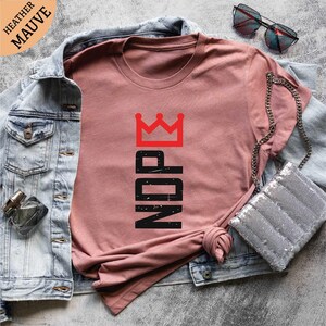 a pink shirt with the word iron on it
