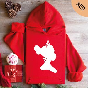 a red hoodie with a white silhouette of a girl