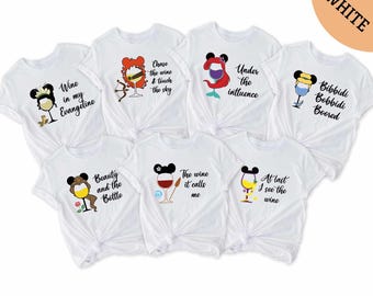 May include: Set of 7 white t-shirts with different Disney princess-themed wine-related sayings and graphics. The sayings include "Wine in my Evangeline", "Chase the wine & touch the sky", "Under the influence", "Bibbidi Bobbidi Boored", "Beauty and the Bottle", "The wine it calls me", and "At last I see the wine".