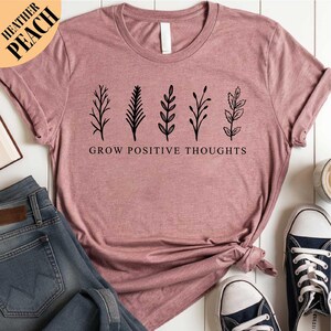 a t - shirt that says grow positive thoughts