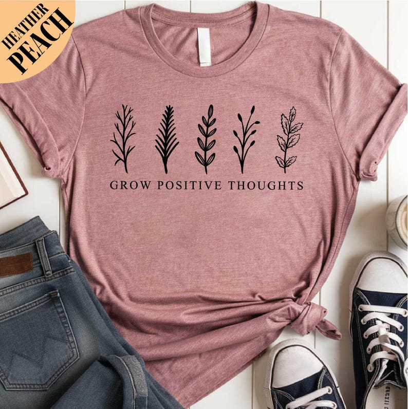 a t - shirt that says grow positive thoughts