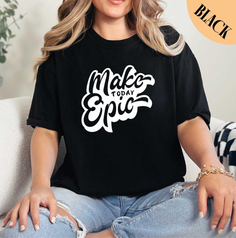 a woman sitting on a couch wearing a black shirt