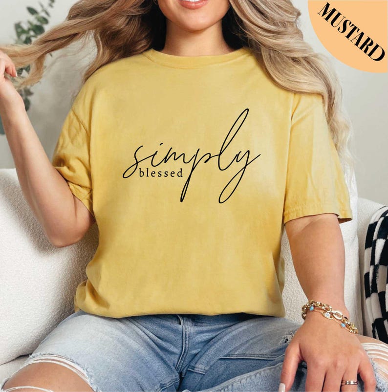 a woman sitting on a couch wearing a yellow shirt