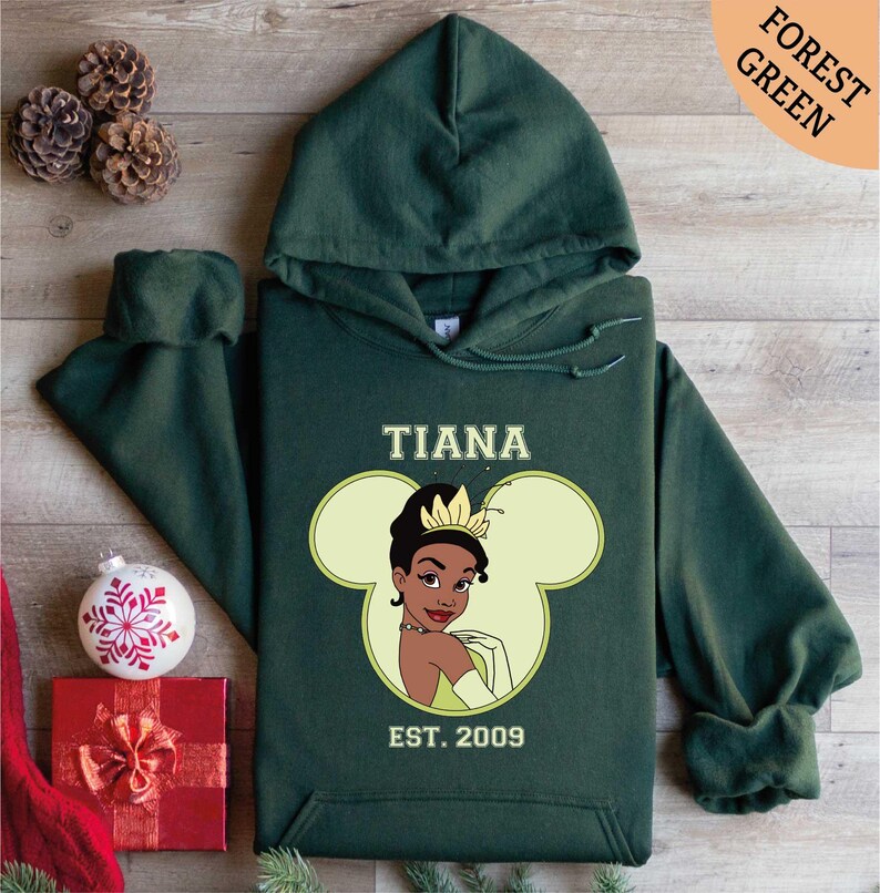 a green hoodie with a picture of a princess on it