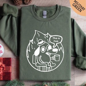 a green shirt with a picture of a dog on it